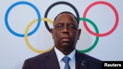 FILE - Senegal's President Macky Sall poses after signing the contract for the 2022 Youth Olympic Games, to be hosted in Senegal, at the 133rd IOC session in Buenos Aires, Argentina, Oct. 8, 2018.