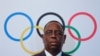 FILE - Senegal's President Macky Sall poses after signing the contract for the 2022 Youth Olympic Games, to be hosted in Senegal, at the 133rd IOC session in Buenos Aires, Argentina, Oct. 8, 2018.
