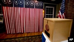 FILE - A ballot box is set for residents to vote in Dixville Notch, New Hampshire, Nov. 7, 2016. A request for detailed information about every voter in the U.S. from President Donald Trump's voting commission is getting a rocky reception in some states.