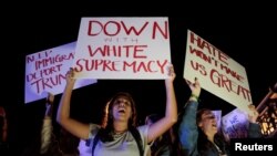 People protest against U.S. President-elect Donald Trump in Miami, Florida, Nov. 11, 2016. 