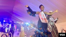 Kabasambo Esther, winner of the Miss Y+ Beauty Pageant 2019-2020, in Kampala, Uganda, waves to the audience, Nov. 22, 2019. (Halima Athumani/VOA)