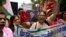 Activists shout slogans against China during a protest in New Delhi July 4, 2017. The protest was over China's decision to suspend pilgrimages to a sacred site in Tibet following tension between Indian and Chinese troops along the India-China border. 
