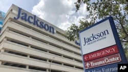 FILE - An entrance at Jackson Memorial Hospital is shown, July 9, 2020, in Miami. Florida. 