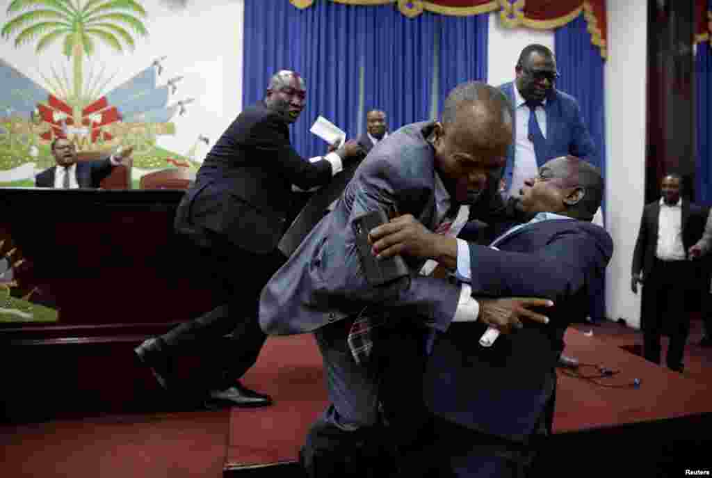 Deputies argue before a session to present the general policy of the appointed Prime Minister Fritz William Michel at the Parliament in Port-au-Prince, Haiti, Sept. 3, 2019.