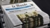 Copies of the French newspaper Le Monde with the headline "Trump Provokes Chaos in Washington" are seen at at Le Monde headquarters, in Paris, Jan. 7, 2021.