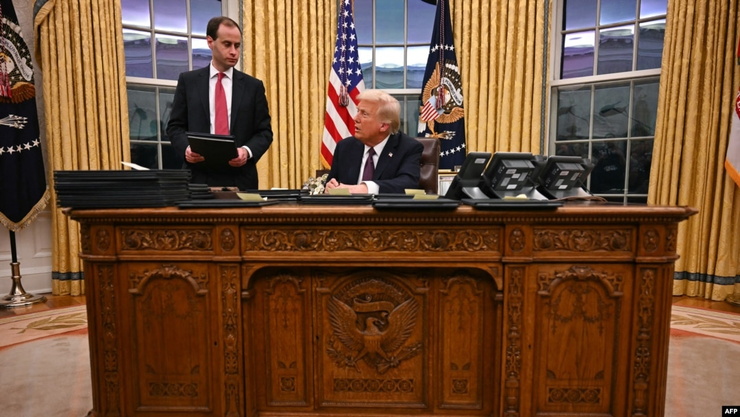 President Donald Trump speaks to journalists as he signs executive orders in the Oval Office of the White House in Washington, on Jan. 20, 2025.