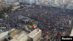 An areal view shows supporters of Senegalese opposition leader Ousmane Sonko gathering during a protest in support of Sonko ahead of a court appearance on Thursday on libel charges, Dakar, Senegal, March 14, 2023. 