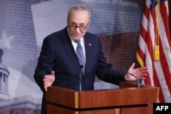 Minority Leader Charles Schumer (D-NY) talks to reporters on April 21, 2020, in Washington.