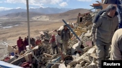 Rescue teams work amidst rubble in the aftermath of an earthquake in a location given as Shigatse City, Tibet Autonomous Region, China, in this screengrab obtained from a handout video released on Jan. 7, 2025. (Tibet Fire and Rescue/Handout via REUTERS) 