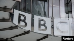 FILE - Signage is seen at BBC offices and recording studios, in London, Britain, May 21, 2021.