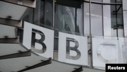 FILE - Signage is seen at BBC offices and recording studios, in London, May 21, 2021.