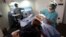 Fahad Ali, a 27-year old medical tourist from Britain, is prepared for hair transplant at a clinic of Esteworld, an aesthetic private hospital group, in Istanbul Mar. 30, 2013.