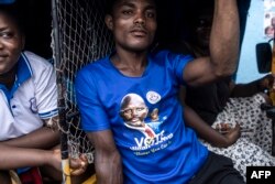 A man wears a t-shirt featuring Liberian President George Weah in Monrovia, on October 4, 2023. Liberia is scheduled to hold general elections on October 10, 2023.