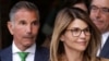 FILE - In this April 3, 2019, photo, actress Lori Loughlin, front, and her husband, clothing designer Mossimo Giannulli, left, depart federal court in Boston after a hearing in a nationwide college admissions bribery scandal.