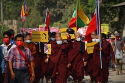 Anti-coup protesters, monks among them, march in Sagaing, Sagaing region, Myanmar, March 20, 2021. (Credit: Citizen journalist via VOA's Burmese Service)