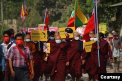 Anti-coup protesters, monks among them, march in Sagaing, Sagaing region, Myanmar, March 20, 2021. (Credit: Citizen journalist via VOA's Burmese Service)