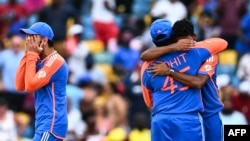 India's captain Rohit Sharma (2nd R) celebrates with teammates after winning the ICC men's Twenty20 World Cup 2024 final cricket match between India and South Africa at Kensington Oval in Bridgetown, Barbados, on June 29, 2024. (Photo by Chandan KHANNA / 