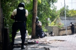 FILE - Police search the Morne Calvaire district of Petionville for suspects who remain at large in the killing of Haitian President Jovenel Moise in Port-au-Prince, Haiti, July 9, 2021. Moise was assassinated on July 7.