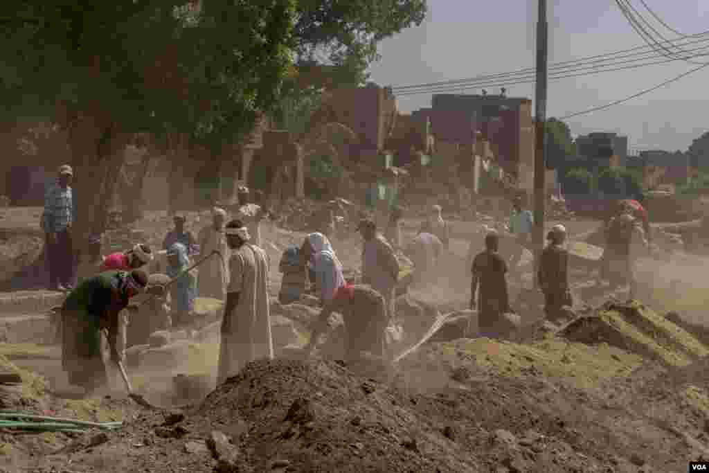 Months before the pandemic struck, workers removed sand and debris from the ancient Avenue of Sphinxes in Luxor, Egypt on Sept. 8, 2019. (Hamada Elrasam/VOA)