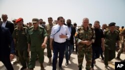 Libyan Prime Minister Prime Minister Abdul Hamid Dbeibah attends the reopening of the road between the cities of Misrata and Sirte Sunday, June 20, 2021. Later media reports on June 21, 2021 said the road was closed again.