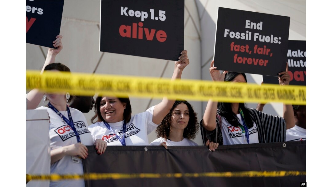FILE - Activists protest against fossil fuels at the COP28 U.N. Climate Summit on Dec. 5, 2023, in Dubai, United Arab Emirates.