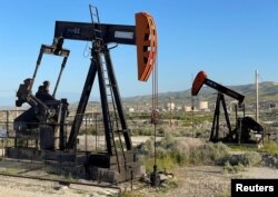 Oil drilling equipment is seen on federal land near Fellows, California