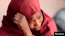 The mother of Muhammad Bello, one the students who was abducted by gunmen, reacts in Kankara, in northwestern Katsina state, Nigeria, Dec. 14, 2020.