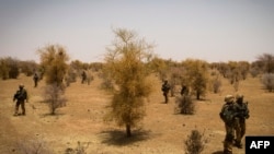 FILE - A photo taken on April 10, 2013 shows French soldiers taking part, 105 kms north of the northeastern Malian city of Gao, in an operation to find Islamist fighters. 