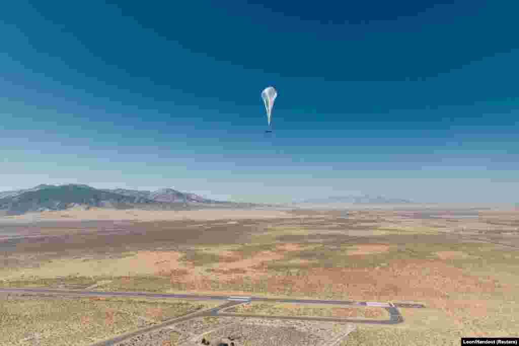 A Loon internet balloon, carrying solar-powered mobile networking equipment, flies over the company&#39;s launch area in Winnemucca, Nevada.