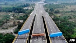 Aerial view of the Tienditas Bridge, in the border between Cucuta, Colombia and Tachira, Venezuela, after Venezuelan military forces blocked it with containers on February 6, 2019.