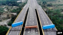 Aerial view of the Tienditas Bridge, along the border between Cucuta, Colombia, and Tachira, Venezuela, after Venezuelan military forces blocked it with containers, Feb. 6, 2019.