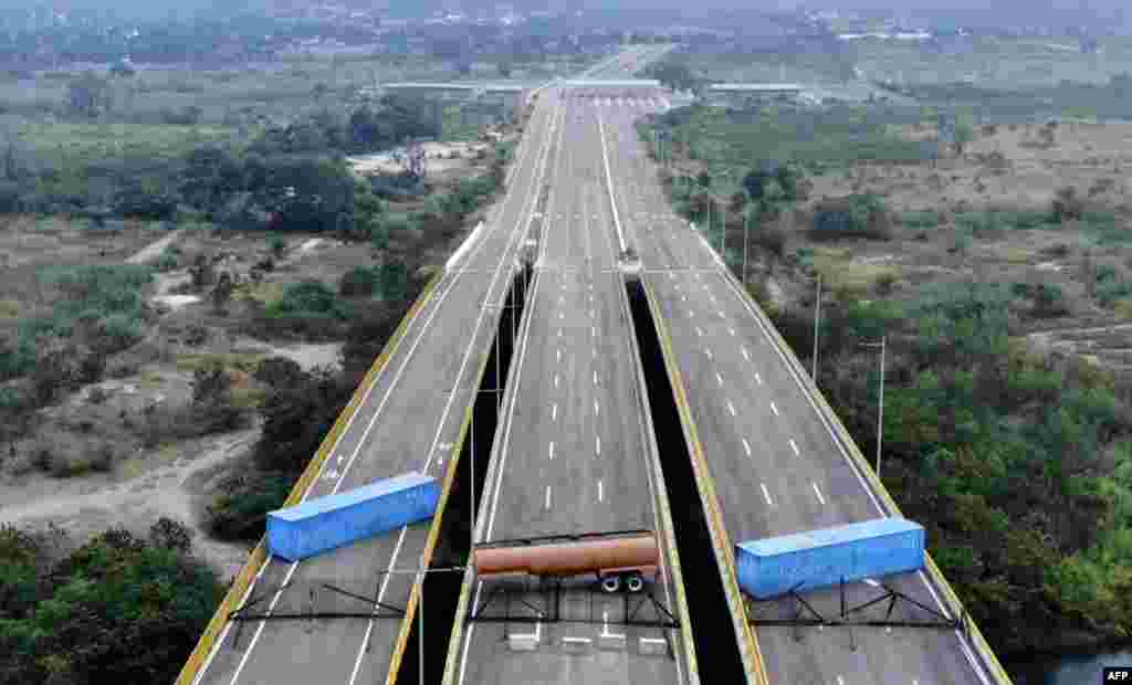 Venezuelan military forces block the Tienditas Bridge — on the border between Cucuta, Colombia and Tachira, Venezuela — with containers. Venezuela blocked the bridge ahead of an anticipated humanitarian aid shipment, as opposition leader Juan Guaido stepped up his challenge to disputed President Nicolas Maduro's authority.