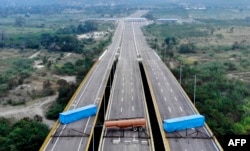 Aerial view of the Tienditas Bridge, on the border between Cucuta, Colombia and Tachira, Venezuela, after Venezuelan military forces blocked it with containers on February 6, 2019.