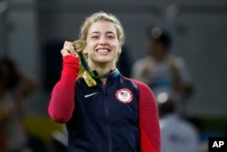 FILE - United States' Helen Louise Maroulis reacts during the winners ceremony for the women's 53-kg freestyle wrestling competition at the 2016 Summer Olympics in Rio de Janeiro, Brazil, Aug. 18, 2016.