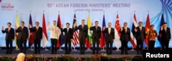 Singapore’s Prime Minister Lee Hsien Loong and ASEAN foreign ministers pose for a group photo during the opening ceremony of the 51st ASEAN Foreign Ministers' Meeting in Singapore, Aug. 2, 2018.