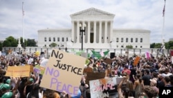 Protesters gather outside the U.S. Supreme Court in Washington on Friday, June 24, 2022, the day a ruling rescinded abortion rights. (Jacquelyn Martin/AP)