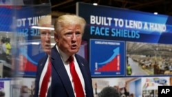 President Donald Trump speaks as he tours Ford's Rawsonville Components Plant that has been converted to making personal protection and medical equipment May 21, 2020, in Ypsilanti, Mich.