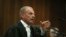 State prosecutor Gerrie Nel, questions Oscar Pistorius in court in Pretoria, South Africa, Apr. 15, 2014. 