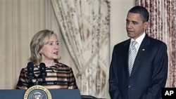 President Barack Obama is introduced by Secretary of State Hillary Rodham Clinton at a holiday reception for international diplomats at the State Department in Washington, where they praised the work of the late Amb. Richard Holbrooke, Dec 13, 2010