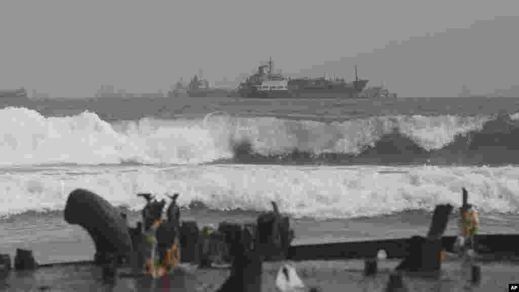 The rusting hulk of an abandoned ship is beached on the coastline of Nigeria.