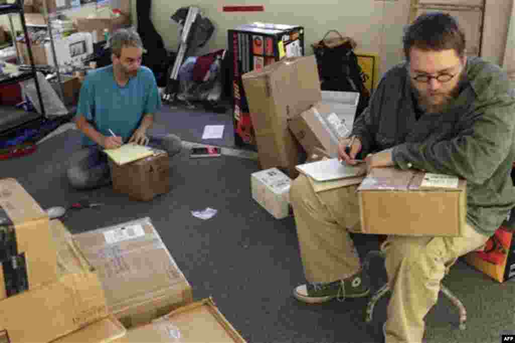 In a photo taken Wednesday, Oct. 26, 2011, Occupy Wall Street protesters open packages sent to the protesters in New York. Since the protests began on Sept. 17, protesters at the Zuccotti Park encampment say they�ve received about 100 letters a day. (AP P