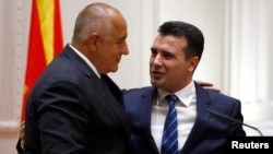 Bulgarian Prime Minister Boyko Borissov speaks to his Macedonian counterpart Zoran Zaev following an official signing ceremony in Skopje, Macedonia, Aug. 1, 2017. 