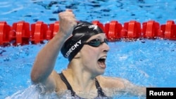 Katie Ledecky (USA) of USA celebrates after setting a new world record.