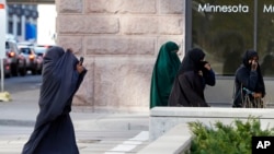 FILE - Female members of Minnesota's Somali community are seen arriving at the Federal Court building in St. Paul, Minnesota, April 23, 2015.