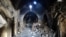 A citizen journalism image provided by Aleppo Media Center AMC which has been authenticated based on contents and AP reporting, shows Syrian rebels standing in the middle of a medieval market in Old Aleppo, which has been destroyed by fighting.