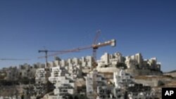 Houses under construction are seen in a Jewish settlement near Jerusalem known to Israelis as Har Homa and to Palestinians as Jabal Abu Ghneim, 08 Dec 2010