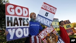 A 2010 file photo shows Westboro Baptist Church members holding anti-gay signs at Arlington National Cemetery in Virginia on Veterans Day, November 11, 2010