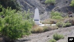 Boundary Monument 1, a historic U.S.-Mexico border marker, seen from Sunland Park, N.M., Wednesday, April 24, 2019