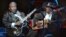 Blues legend B.B. King, left, performs with Bo Diddley at the second anniversary celebration of B.B. King's Blues Club and Grill in New York, June 20, 2002.