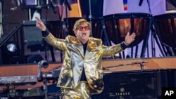 FILE - Elton John performs during Glastonbury Festival in Worthy Farm, Somerset, England, Sunday, June 25, 2023. (Joel C Ryan/Invision/AP)